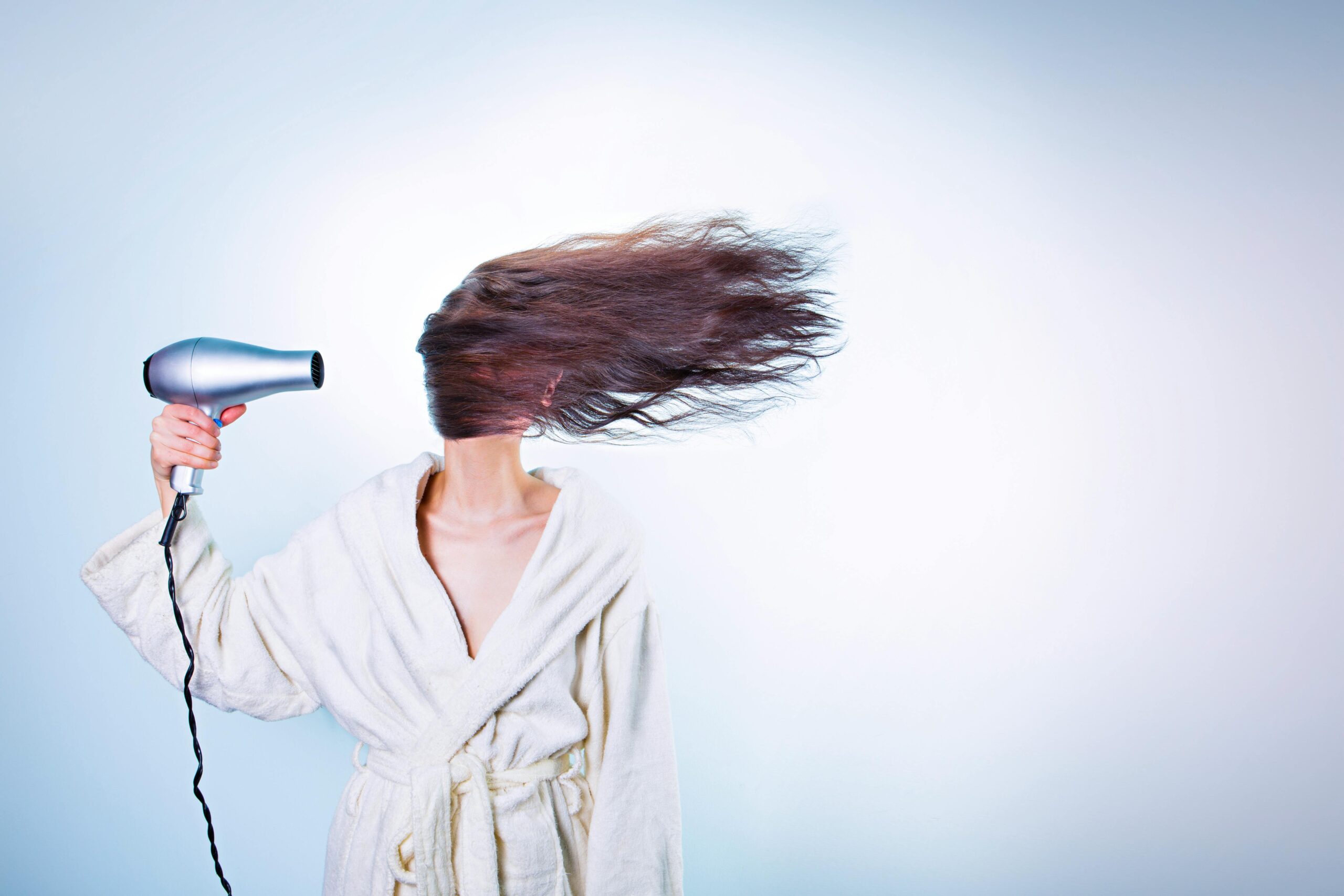 hair dryer to dry oil paints on a canvas